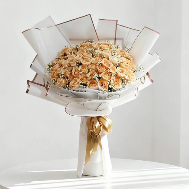 Elegant bouquet of peach roses wrapped in white, ideal for flower delivery in Singapore
