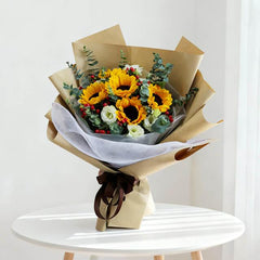 Sunflower bouquet with greenery and white blooms for online flower delivery in Singapore