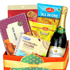 Gift hamper with festive snacks and sparkling juice for flower delivery in Singapore