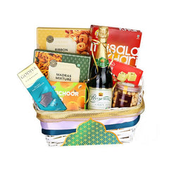 Gift basket with snacks, chocolate, grape juice and treats, ideal for hamper flower delivery Singapore.