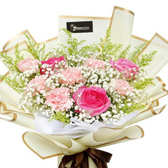 Fresh pink roses and carnations bouquet with baby's breath for flower delivery