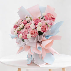 Pastel pink rose bouquet with white accents, elegant flower delivery arrangement
