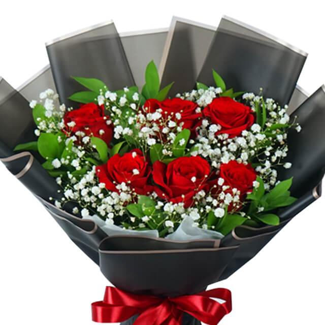 Red rose bouquet with baby's breath and greenery for flower delivery