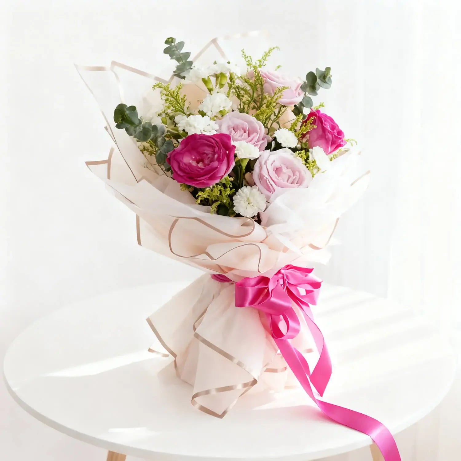 Pastel flower bouquet with pink and purple roses for flower delivery in Singapore
