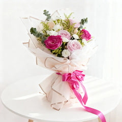 Pastel flower bouquet with pink and purple roses for flower delivery in Singapore