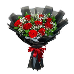 Red rose bouquet with baby’s breath and greenery, perfect for flower delivery in Singapore