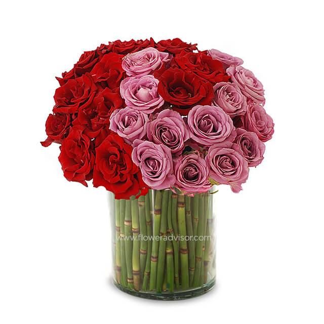 Red and pink rose bouquet in glass vase for online flower delivery in Singapore