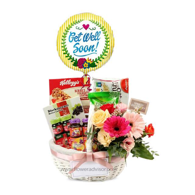 Get well soon hamper with fresh flowers, snacks, and balloon for flower delivery