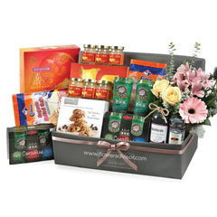 Luxury gift hamper with fresh flowers, gourmet snacks, and premium treats for same-day delivery across Singapore