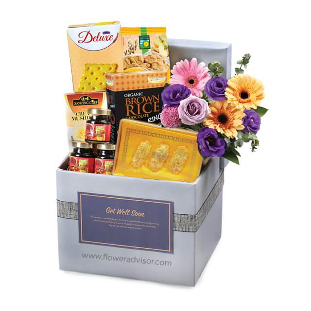 Get well soon flower delivery hamper with fresh mixed flowers and assorted treats
