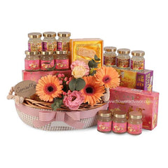 Fresh flower hamper with orange gerberas, pink roses, and gift jars, ideal for Singapore flower delivery