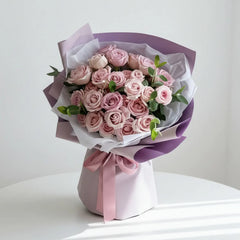 Elegant pink rose bouquet with greenery, perfect for flower delivery in Singapore