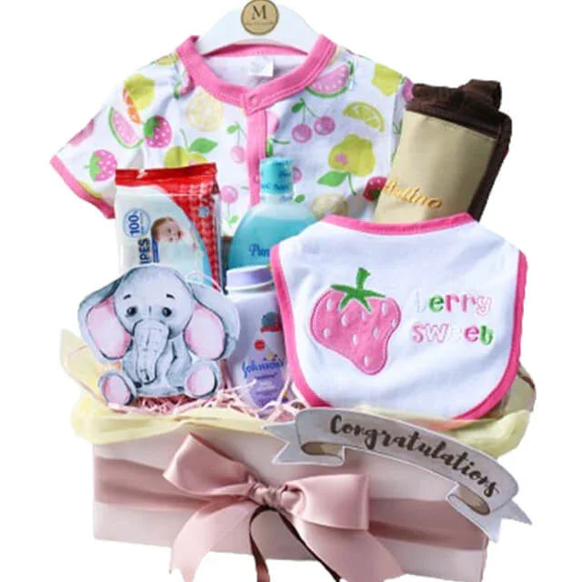 Baby hamper with clothes, baby care products, plush toy, and congratulations ribbon for delivery.