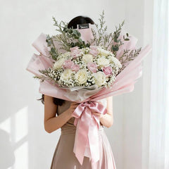 Elegant bouquet with pink and white roses, ideal for flower delivery in Singapore
