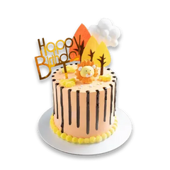 Happy Birthday cake with lion topper, chocolate drizzle, and floral accents for delivery