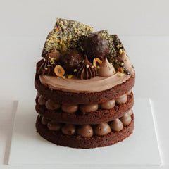 Deluxe chocolate cake with nut topping, perfect for gift delivery or special celebrations