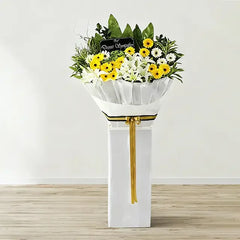 Elegant flower stand with white lilies, yellow and white daisies for flower delivery in Singapore.