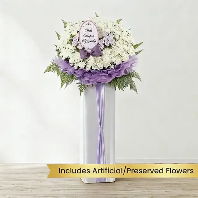 Sympathy flower stand with white and purple artificial blooms for delivery in Singapore