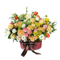 Mixed flower bouquet in a basket for flower delivery, featuring roses, tulips, and fillers
