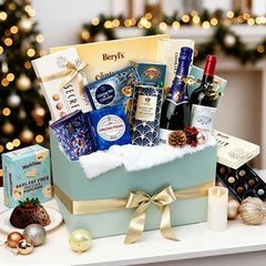 Elegant gift hamper with wine, chocolates, gourmet treats, flowers and festive decor, ideal for flower delivery in Singapore.