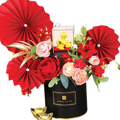 Peony and rose floral arrangement with red paper fans and gold ornaments for flower delivery