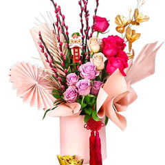 Festive flower bouquet with pink and red roses, gold accents, ideal for flower delivery