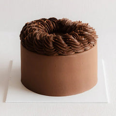Chocolate cake with rich frosting, perfect for flower and cake delivery in Singapore