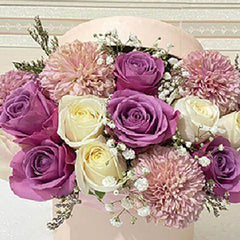 Elegant flower bouquet with purple and white roses, ideal for same-day flower delivery