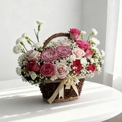 Elegant flower basket with pink and white roses, perfect for flower delivery in Singapore