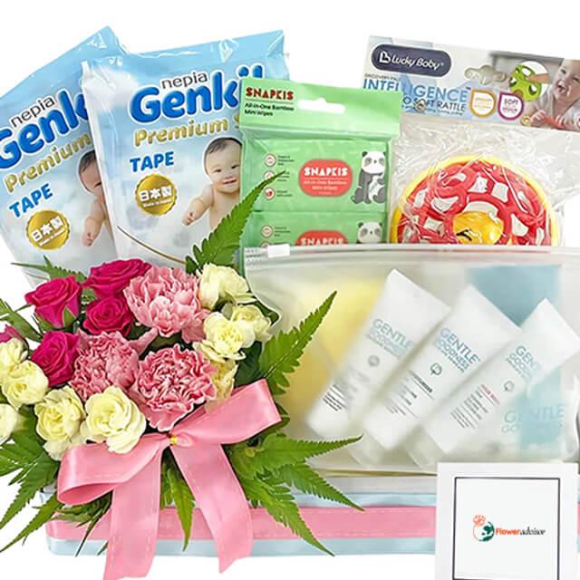 Baby hamper with fresh flower bouquet, diapers, baby care items and gift box, ideal for flower delivery