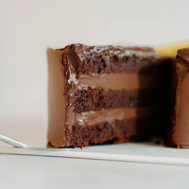Rich chocolate cake with creamy layers, ideal for cake and flower delivery in Singapore