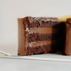 Rich chocolate cake with creamy layers, ideal for cake and flower delivery in Singapore