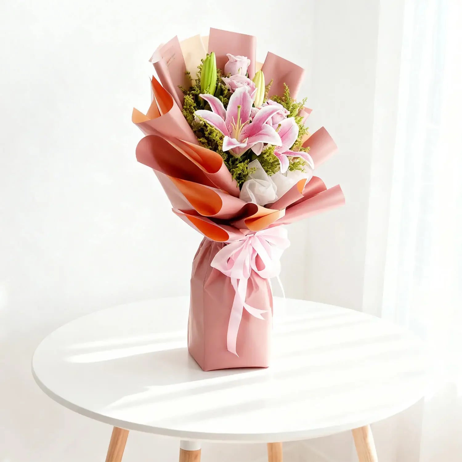 Elegant pink lily bouquet wrapped in pastel paper for flower delivery in Singapore
