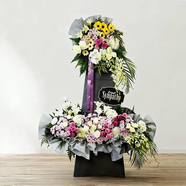 Elegant condolence flower stand with mixed fresh blooms for flower delivery Singapore