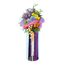 Colorful congratulations flower stand with mixed fresh blooms for delivery