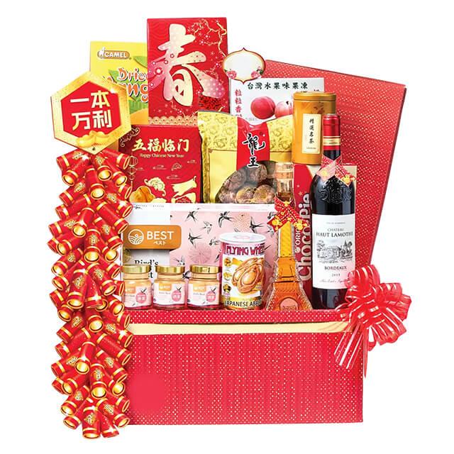 Chinese New Year hamper with festive snacks, wine, and flowers for flower delivery in Singapore