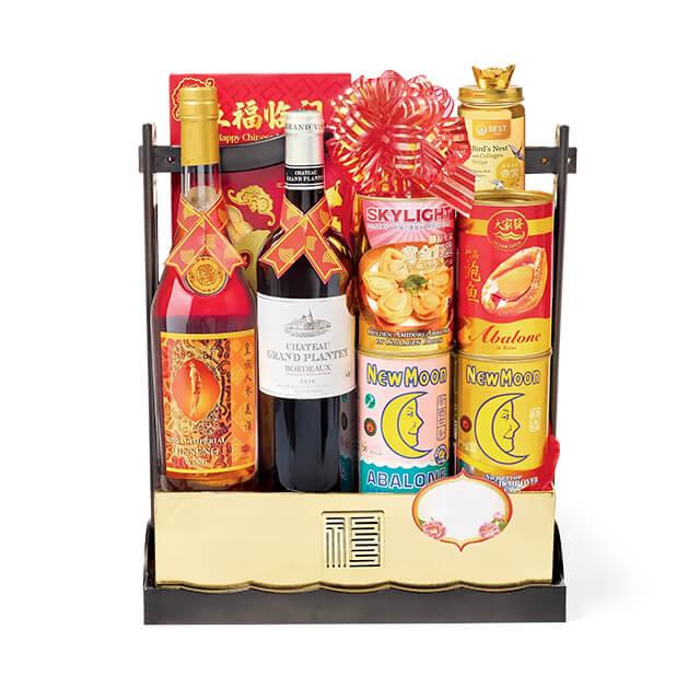 Chinese New Year hamper with wine, abalone, festive foods and gift packaging for delivery