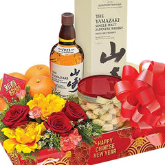 Chinese New Year flower hamper with fresh blooms, oranges, snacks, and whisky for delivery