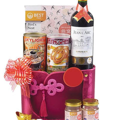 Luxurious gourmet hamper with wine, abalone, bird's nest and festive gift packaging for flower delivery