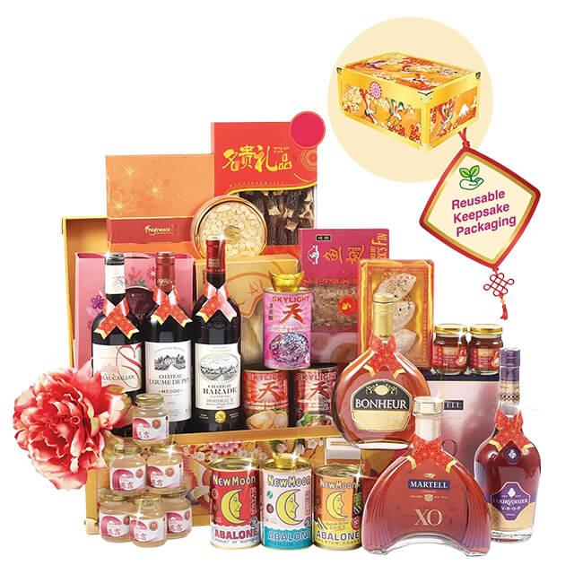 Luxury hamper with wine, spirits, gourmet treats and a decorative flower, for festive flower delivery.