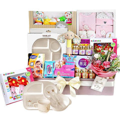 Newborn gift hamper with baby essentials, bird's nest, and pink flower bouquet for delivery