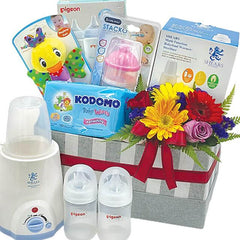 Baby gift hamper with fresh flower arrangement, baby bottles, wipes, and delivery-ready items