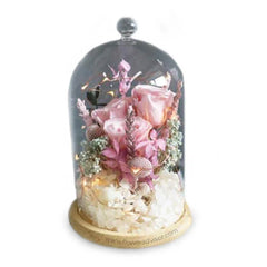 Glass dome with three preserved pink roses and flowers, perfect for flower delivery gift