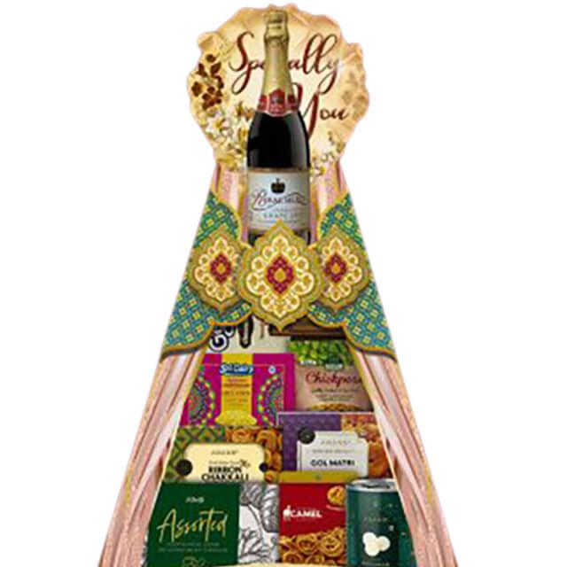 Festive gift hamper with sparkling juice and assorted snacks, suitable for flower delivery gifts