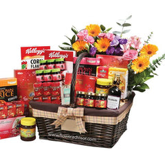 Flower delivery hamper with assorted groceries, fresh mixed flowers, and vibrant gift basket