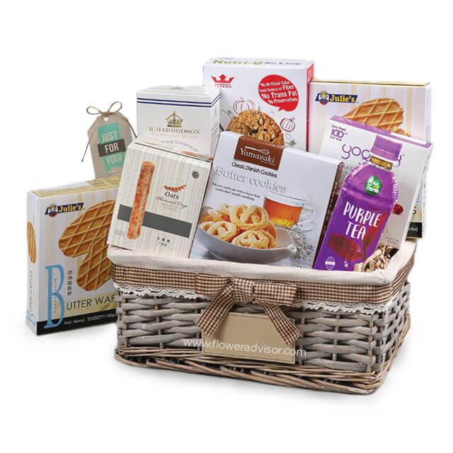 Gourmet snack hamper with cookies, tea, and treats for gift and flower delivery in Singapore
