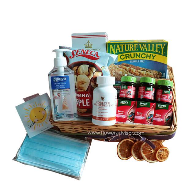Gift hamper with snacks, supplements, hand sanitizer, masks and card for flower delivery