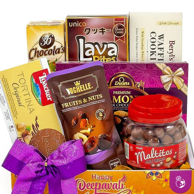 Gift hamper with assorted chocolates, cookies, nuts and festive bow for delivery.