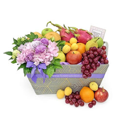 Fresh flower and fruit basket for delivery with roses, hydrangea, apples, grapes, and oranges