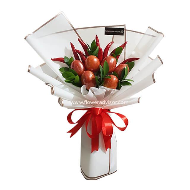 Unique vegetable bouquet with tomatoes and red chili peppers, wrapped for flower delivery